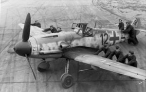 Luftwaffe ground-crew positioning a Bf 109G-6 equipped with the Rüstsatz VI.